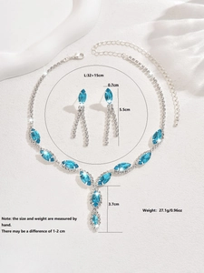 Detailed view of marquise cut water blue gemstone bridal necklace and fringe earring set
