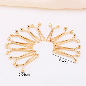 Detail view of 3.4cm golden U-shaped scarf clip pins with smooth round bead ends