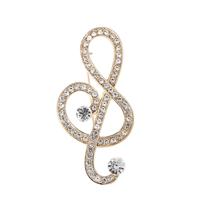 Elegant gold treble clef brooch with sparkling crystals and large clear gemstones