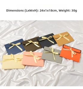 Detail of elegant envelope gift boxes with silk ribbon bows in multiple colors