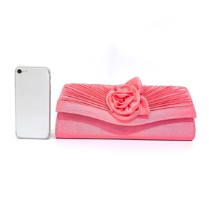 Detail of pink satin evening clutch bag with rose flower design and pleats
