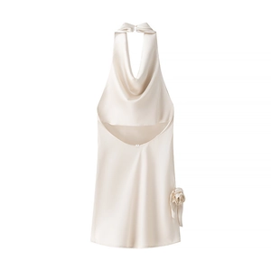 Detail of elegant satin halter top featuring a 3D rose flower and pleated neckline