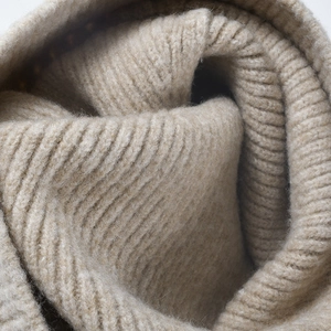 Oatmeal knit beanie with warm ribbed texture and oversized fit for outdoor winter comfort