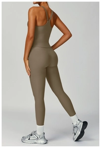 Detail of ribbed yoga set featuring a cross-back sports bra and high-waist leggings