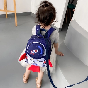 Close-up of kids space backpack showing safety leash and astronaut rocket pattern