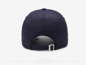 Detail view of the navy blue baseball cap back with adjustable silver metal buckle