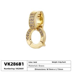 Detailed close-up of gold-plated brass figure-eight connector with cubic zirconia stones