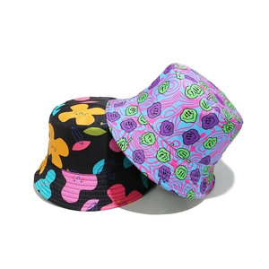 Colorful bucket hats with floral patterns and graffiti smiley faces for outdoor sun protection