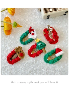 Detailed view of handmade crochet Christmas hair clips set including Santa and Reindeer