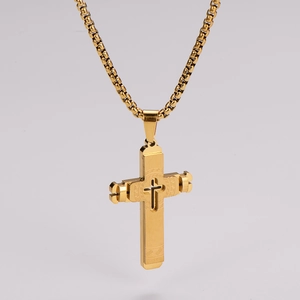 Detailed view of layered hollow gold cross pendant with high polished metal chain
