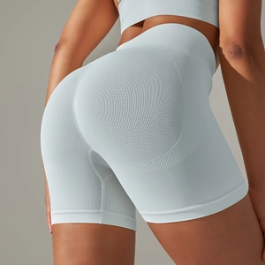 Detailed back view of seamless light blue high-waisted shorts with butt-lifting texture