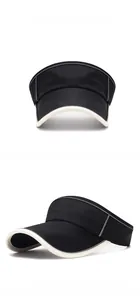 Macro detail of black sun visor with beige trim and reflective side stripes