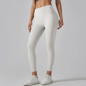 Detail of high-waisted yoga leggings with side curved stitching and lift effect