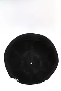 Detail of black retro docker hat interior showing breathable fabric and metal adjustment buckle