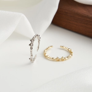 Elegant S925 sterling silver butterfly open rings in gold and silver finishes on silk