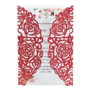 Detail of red glitter laser-cut rose invitation cover with floral printed insert card