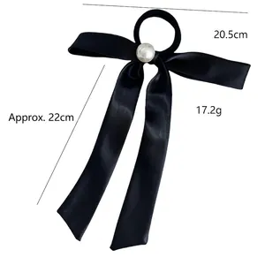Elegant black satin bow hair tie with large white pearl detail shown with measurements