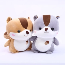 Close-up of brown and gray plush teddy bears featuring embroidered acorn details