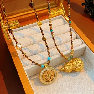 Tiger eye beaded necklace with gourd pendant and mandala charms in luxury style