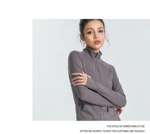 Detail of slim-fit yoga jacket featuring long sleeves with functional thumb holes