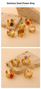 Detail of 18K gold plated stainless steel rings with colorful beaded flower and hammered texture