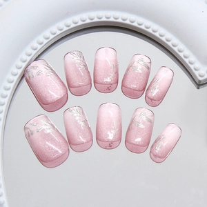 Pink cat eye press-on nails with silver leaf patterns and 30 pieces short oval style