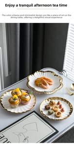 Detailed top view of Nordic style gold-rimmed ceramic dessert plates for tea time