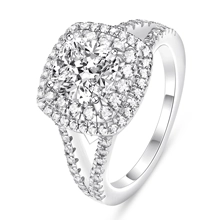 Macro view of cushion cut cubic zirconia ring with a double halo and split diamond band