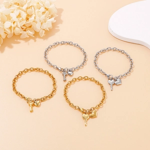 Gold and silver stainless steel chain bracelets with heart and key pendants