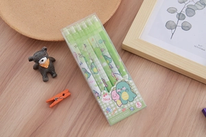 Detail of 0.5mm mechanical pencils featuring cute green dinosaur cartoon patterns
