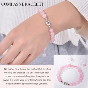 Detail of pink natural stone beaded bracelet with silver compass charm and adjustable cord