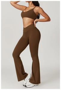 Detail of dark brown high-waisted flared yoga pants with V-shaped crossover waist design