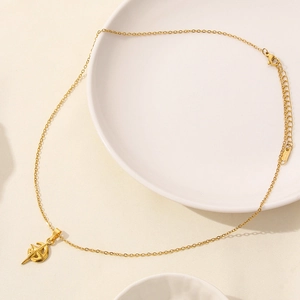 Macro shot of 18K gold plated stainless steel necklace clasp with S.STEEL hallmark tag