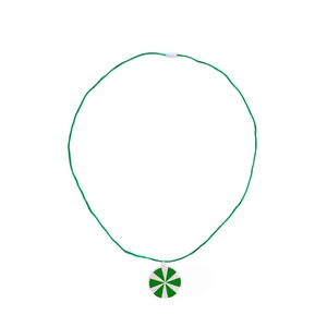 Detail view of a green cord necklace with a silver star pattern round pendant