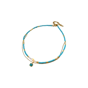 Collana a doppio strato placcata in oro con perle di turchese e perla d'acqua dolce e ciondolo