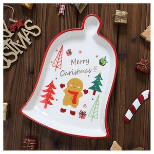 Bell-shaped Christmas ceramic plate with hand-painted gingerbread man and festive details