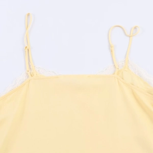 Detail of yellow lace camisole showing the V-neckline and fine adjustable shoulder straps