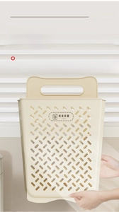Detail of wall-mounted laundry basket featuring breathable hollow vents and handle