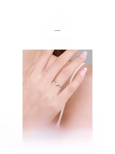 Macro shot of minimalist S925 sterling silver ring featuring a single round-cut zircon