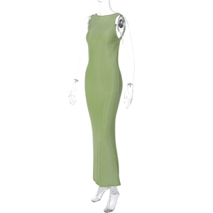 Detail of light green slim fit maxi dress featuring subtle glitter texture and side slit