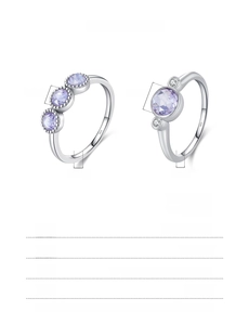 Macro detail of S925 sterling silver rings featuring round purple crystal settings