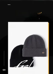 Detailed close-up of fuzzy knit beanies with metallic M logos in black and dark grey