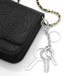 Black camellia embossed shoulder bag with rhinestone key charms and chain strap