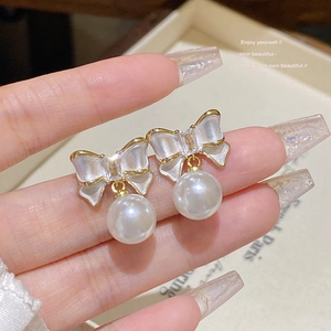 Elegant 925 silver needle bow pearl earrings with gold plating and zircon details