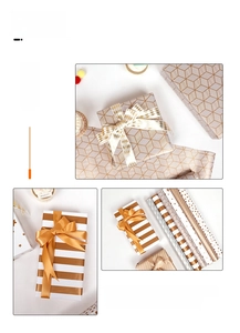 Detail of gold foil gift wrapping paper rolls with geometric patterns and satin ribbons