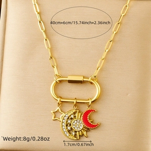 Detail of celestial necklace with gold paperclip chain and red enamel moon pendant