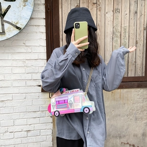 Detail of laser holographic ice cream truck crossbody bag with gold chain strap