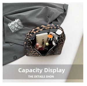 Interior view of leopard print bucket bag showing spacious storage for cosmetics and items