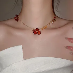 Elegant retro acrylic chiffon flower pendant necklace with gold beads on model