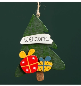 Detail of wooden Christmas tree ornament with Welcome text and mini gift box patterns
